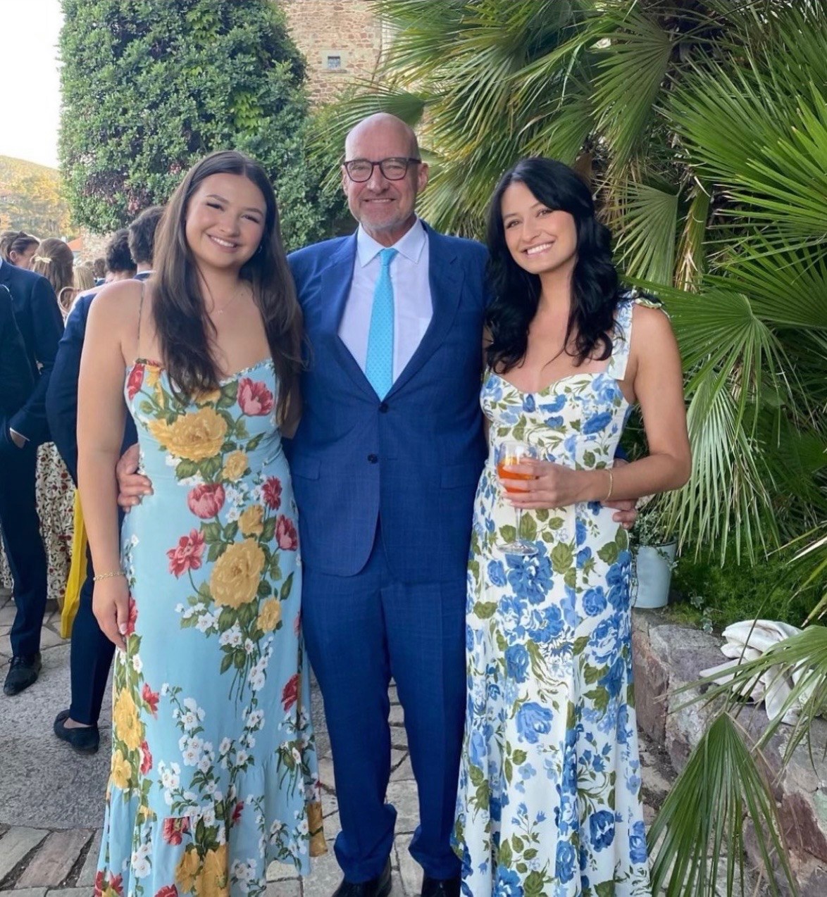 Michael with both his daughters at a wedding.